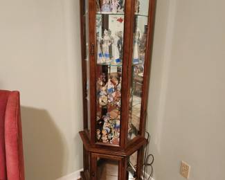 Small curio filled with more figurines.