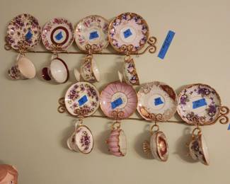 Several beautiful cups and saucers.