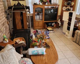 Sun room filled with solid oak items and media stand fill of cds, dvds etc...