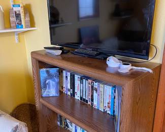 Tv and bookcase with DVDS 
