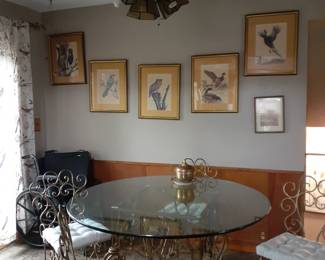 Round glass top table, Four chairs, two more similar chairs in basement, signed bird prints