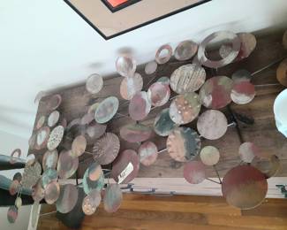 One of three metal wall hangings