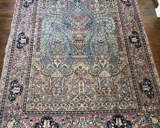 Vintage Kirman Rug. Measures 4' 9" x 7'. Photo 1 of 3.