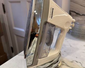 Rowenta Iron. We also have an ironing board and an Oreck Vacuum.