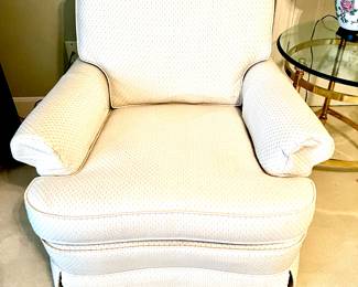 Pair of cream swivel/rocker armchairs