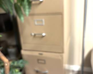 Two metal file cabinets shown stacked