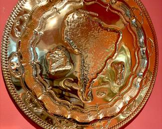 Large brass wall hanging of South America