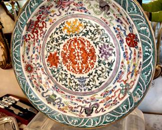 Signed vintage 20" charger mounted on lucite stand