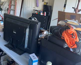 Garage full of electronic equipment , tools golf clubs and more 