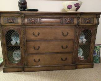 old fashioned credenza
62"L
18"W
38"H

6 drawers and 2 lockable glass cabinets (key included)
can function as a desk