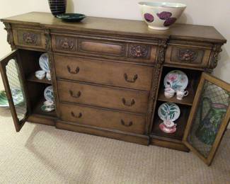 old fashioned credenza
62"L
18"W
38"H

6 drawers and 2 lockable glass cabinets (key included)
can function as a desk