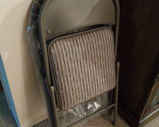 2 cushioned folding chairs