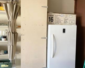 Storage cabinet with shelves 8 feet tall and Insignia upright Freezer, Model NSUZ14XWH7