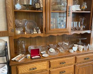 Built in hutch loaded with crystal, glass serving pieces, mid century trays, cake plates, bone china and more