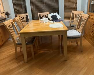 Blonde wood table with black slash inlay.