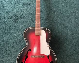 Beautiful guitar - no brand name. We are not able to provide pricing information. Thank you for your understanding.