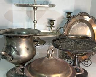 Leonard silverplate casserole 
Reed and Barton brides fruit basket 
Wine cooler 
Small serving tray 
Aluminum 2-tier serving platter 
3-arm candleholder (Needs tightening)