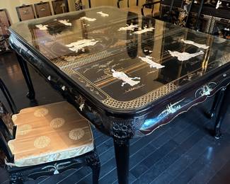 Black Lacquered & Handpainted Dining Table&nbsp;&nbsp;- Carved with Mother of Pearl Inlay - Fitted with glass top - there are 6 side chairs with upholstered cushions, 2 arm chairs with upholstered cushions and 2 table extensions&nbsp;