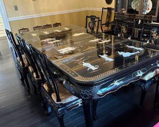Black Lacquered & Handpainted Dining Table&nbsp;&nbsp;- Carved with Mother of Pearl Inlay - Fitted with glass top - there are 6 side chairs with upholstered cushions, 2 arm chairs with upholstered cushions and 2 table extensions&nbsp;