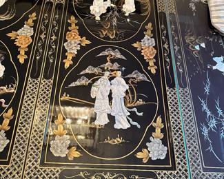 Black Lacquered & Handpainted Dining Table&nbsp;&nbsp;- Carved with Mother of Pearl Inlay - Fitted with glass top - there are 6 side chairs with upholstered cushions, 2 arm chairs with upholstered cushions and 2 table extensions&nbsp;