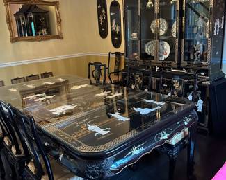 Black Lacquered & Handpainted Dining Table&nbsp;&nbsp;- Carved with Mother of Pearl Inlay - Fitted with glass top - there are 6 side chairs with upholstered cushions, 2 arm chairs with upholstered cushions and 2 table extensions&nbsp;