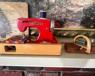 Child’s sewing machine - antique tread spool