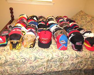 Nascar hats.... most with tags and queen size cherry bed