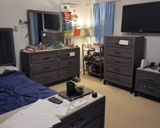 Gray Wood 5Piece Queen Bedroom Set.  Plenty of Dresser space.  Practically new!  Includes: Chest, Bureau (Dresser with Mirror), Night stand with drawers and additional dresser with drawers attached to the bed. 