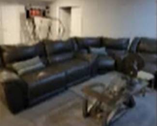 4 Piece Recliner Brown Leather sectional.  Seats 6.  1 Sofa piece displayed in the theater room  sofa picture. All Recliners except the Center Shaped Sofa Seat Practically New 