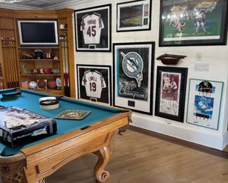 Lots of sports memorabilia - baseball, hockey, golf, tennis, basketball, football
