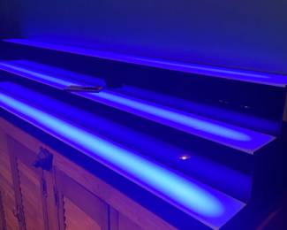 Bar shelf with lights .