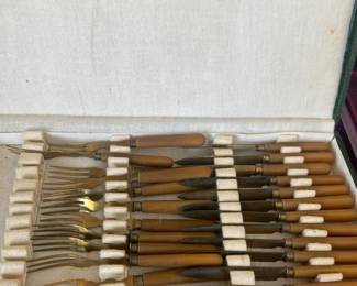 Bakelite set of utensils in case.