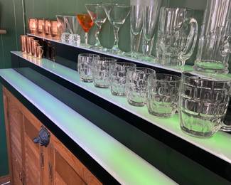 Bar shelf light with vintage barware.