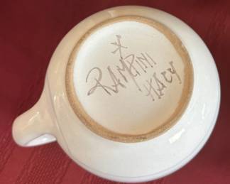 Assorted hand-painted mugs from Italy.