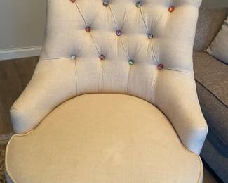 Accent chair with funky buttons.