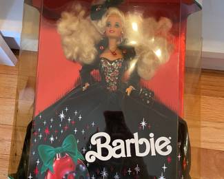 Several Barbie dolls in original boxes.