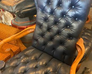Pair of navy blue Leather tufted office chairs.