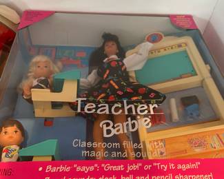 Several Barbie dolls in original boxes.