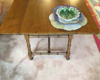 Midcentury modern drop leaf table that can raise & lower the height. Bamboo style legs.$250