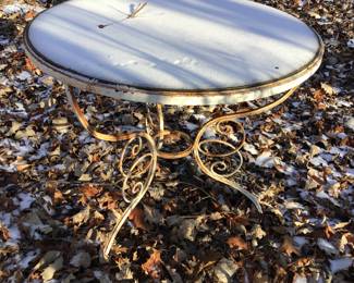 Vintage wrought iron table with glass top. Needs painting.  $85