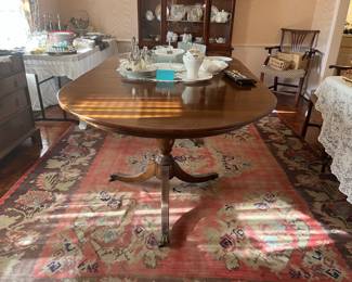 Antique dining table with 4 leaves purchased inEngland for $5000.   Selling now for $1100