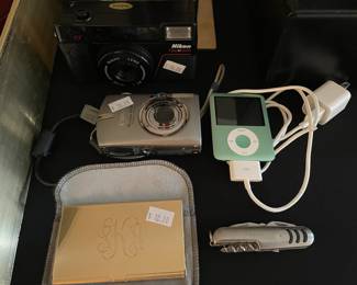 Vintage Nikon One Touch camera, Canon PowerShot SD500 digital camera, Nikon Coolpix L810
