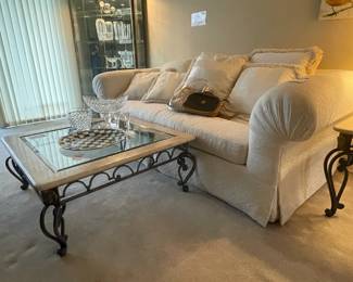 Marble and glass top wrought iron coffee table, McKenzie-Childs Serving Tray, Waterford Crystal Candlesticks, Highland House sofa