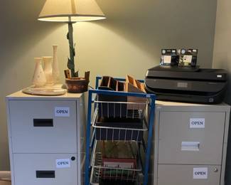 Filing cabinets,   Metal shelf, HP Officejet 5255 printer, Table lamp, Helja Liukko-Sundstrom plaque
