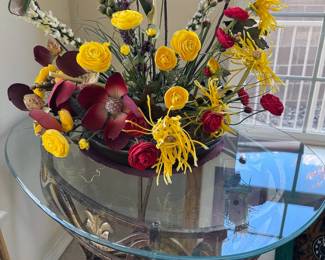 Faux floral arrangement, glass side table