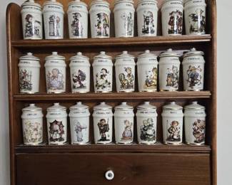 24 Porcelain MJ Hummel Spice Jars with Wall Rack