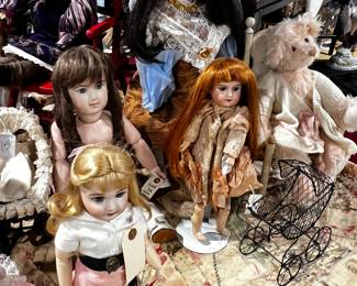 The large one is a very good reproduction of French Doll / brown hat