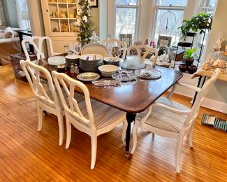 Mahogany table w/2 leaves and pads - can sit 12 but I have had 14 people seated at table -table is wide enough to sit 2 people at each end if needed 