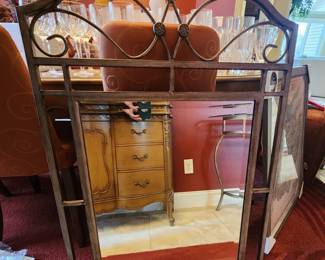 Mirror coordinates with metal and glass table