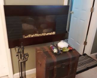 Electric Wall Fireplace $50.00
Iron Fire Place Tool set $25.00
Med Wooden Storage Cabinet $45.00